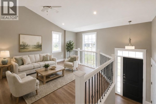 Floor plan shows a foyer, living room, dining area, owner's bedroom, two bedrooms, and a garage. - Lot 4 Kennedy Court, Amherstburg