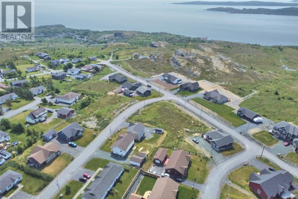 Aerial view of a coastal subdivision with homes and the ocean in the background. - Lot 2 Reid Street, Upper Island Cove