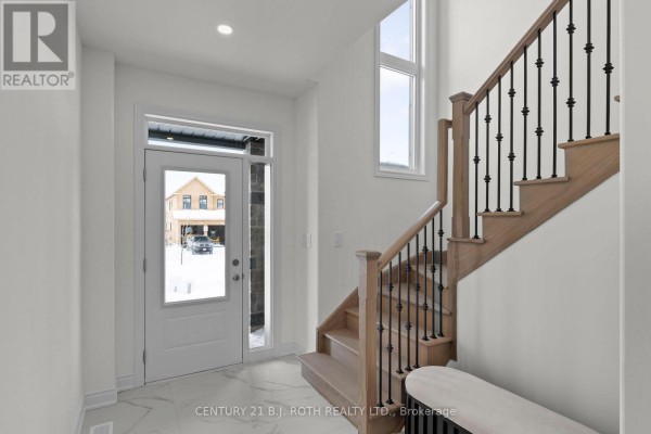 Floor plan shows a main level with dining room, kitchen, and laundry room. - Lot 46 Orion Boulevard, Orillia