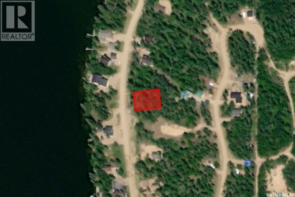 Aerial satellite image highlighting a rectangular red-outlined lot surrounded by trees and other properties. - Lot 7 - Sunset Cres, Cowan Lake