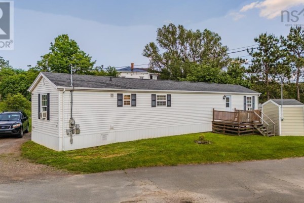 Aerial view of white manufactured home, shed, driveway, and surrounding lots. - Lot 7 & 8 Dalton Court, Bible Hill
