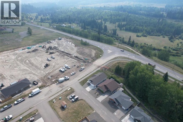 Aerial view of construction site and residential area at a road intersection. - Lot 7-110 Forest Ridge Road, 100 Mile House