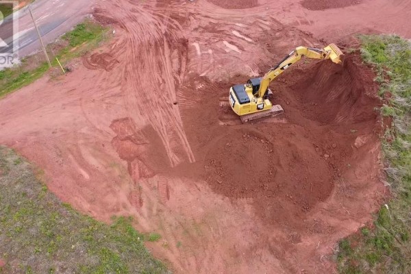 Aerial view of an excavator digging a large pit in red soil on a cleared lot. - Lot 74 Newton Lane, Stratford