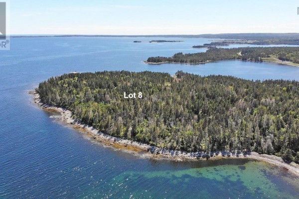 Lot 8 is a large, wooded peninsula surrounded by the sea, seen from above. - Lot 8 Hwy 316 (grovers Pt), Cole Harbour
