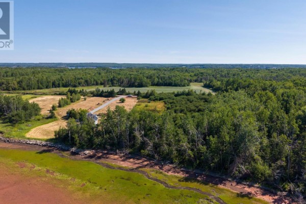 Aerial view of a parcel of land outlined in red, surrounded by trees and fields. - Lot 86-4 Fox Harbour South Road, North Wallace