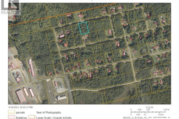 Aerial view of multiple wooded lots and residential properties, with some commercial buildings visible on the left. - Lot 87-73 Beatty Drive, Lower Woodstock
