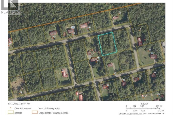 Aerial view showing a residential lot outlined in blue, surrounded by trees and houses. - Lot 89-4 Beatty Drive, Lower Woodstock