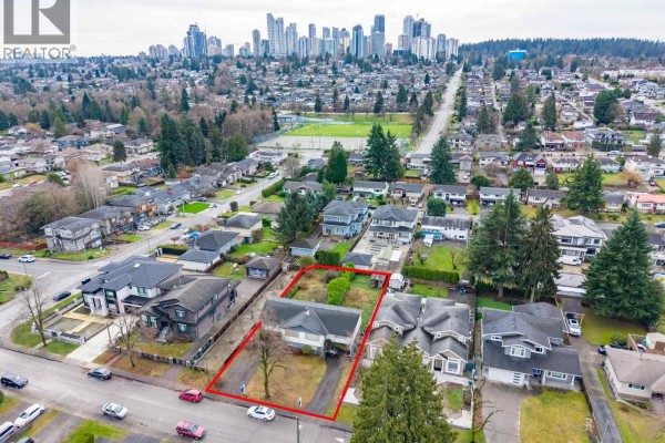 Aerial perspective of the property with city skyline in the background and marked boundaries. - Lot A 4078 Fir Street, Burnaby