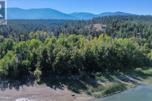 Satellite map indicating the lot boundary in green adjacent to a body of water and Canadian Pacific railway. - Lot A Coy Road Lot# A, Invermere