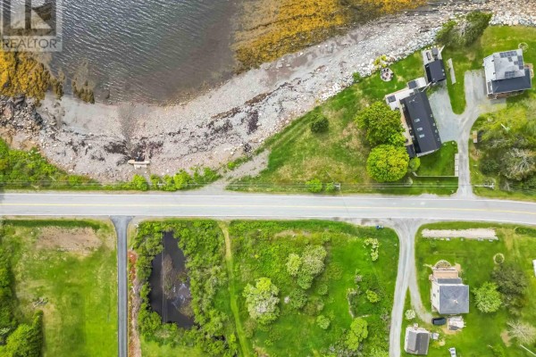 Aerial view of the coastline with houses and a road, showcasing the water's reflection. - Lot B-1 B2 B-3 Parcel 25-1 Highway 331, Dublin Shore