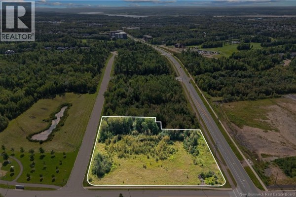 Aerial view of a wooded lot with a white outline, adjacent to a busy road. - Lot Dieppe Boulevard And Yvonne, Dieppe