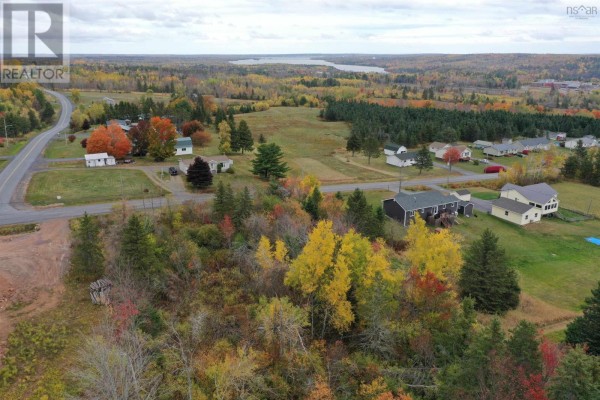Aerial view of a residential area with colorful autumn trees and distant water. - Lot Greenhill Road, Alma