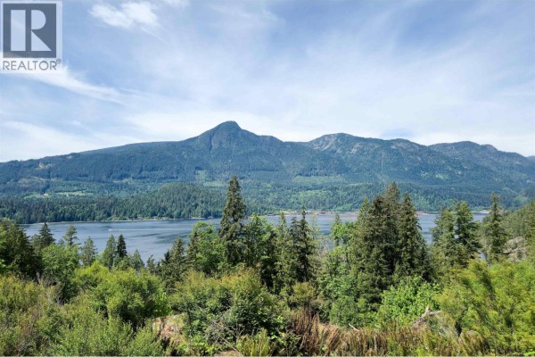 Aerial view of a wooded property lot outlined in yellow on Gambier Island, with coastline visible. - Lot J Cotton Bay Road, Gambier Island