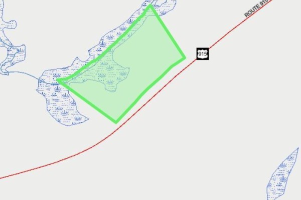 Map showing a plot of land outlined in green, adjacent to Route 915 and a body of water. - Lot Waterside Road, Cape Enrage