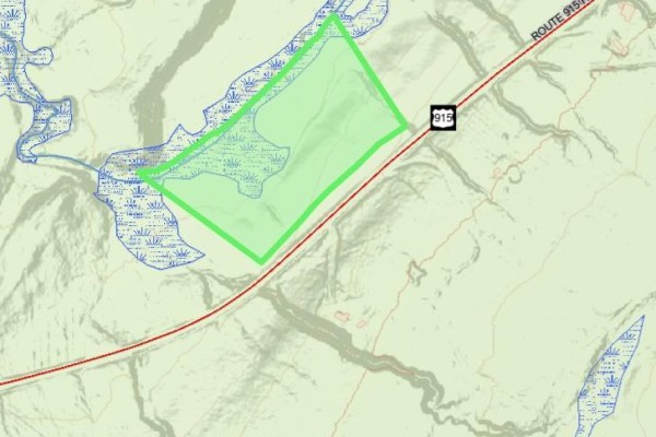 Topographical map display of a green outlined parcel of land near water and a highway. - Lot Waterside Road, Cape Enrage