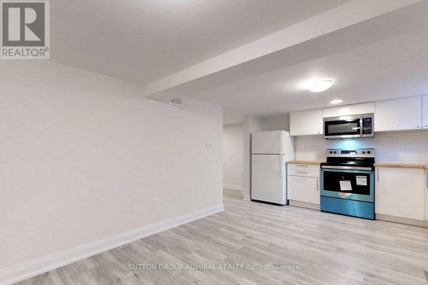 Living room - Lower - 126 Armstrong Avenue, Toronto, ON M6H1V8 Photo 2