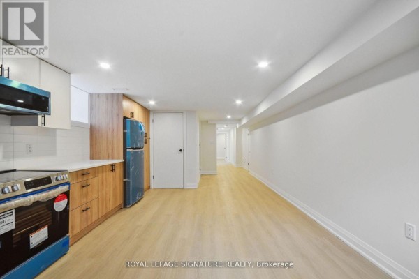 Primary Bedroom - Lower - 129 Kenilworth Avenue, Toronto, ON M4L3S7 Photo 4