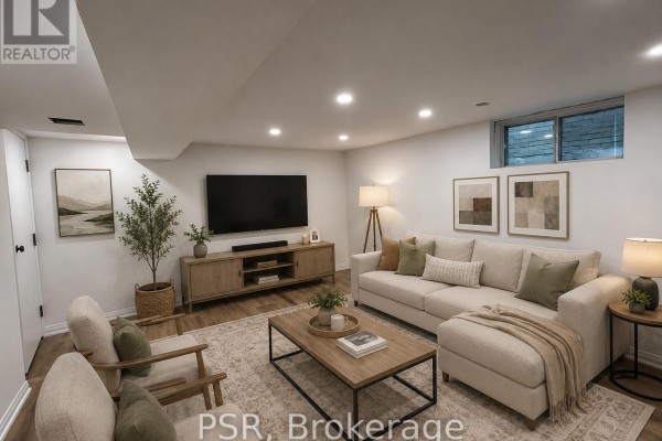 Living room with a sectional sofa, coffee table, television, and accent chairs against a white wall. - Lower - 25 Coulson Avenue, Toronto
