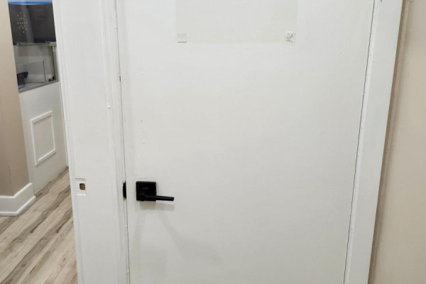 Interior view of a white door leading to another room. - Lower - 357 Main Street E, Hamilton