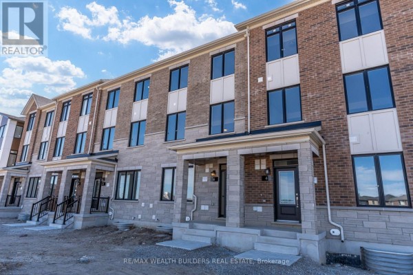 Street view of the townhouse units showing multiple entrances and windows. - Lower - 6 Thornbird Crescent, Brampton
