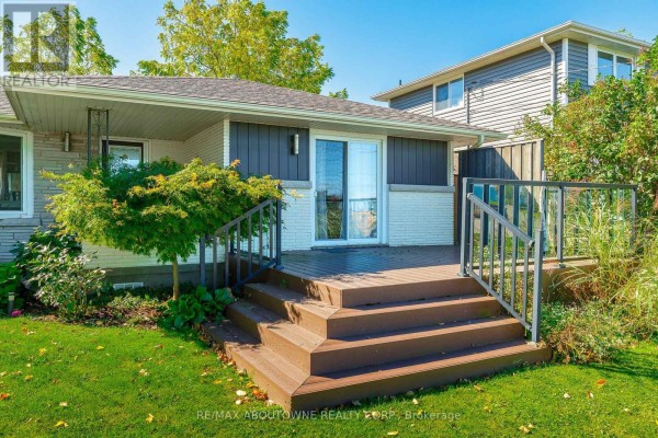 Close-up of the wooden deck and steps on the side of the bungalow. - Lower - 71 Lakeside Drive, Grimsby