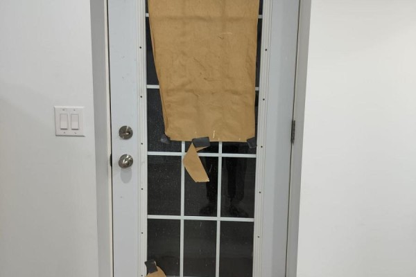 A white door with glass panes covered by taped-on brown paper. - Lower - 852 Mcnair Circle, Milton