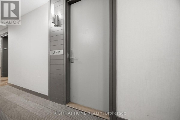 Apartment door LPH01 in a neutral-toned hallway. - Lph01 - 21 Nelson Street, Toronto