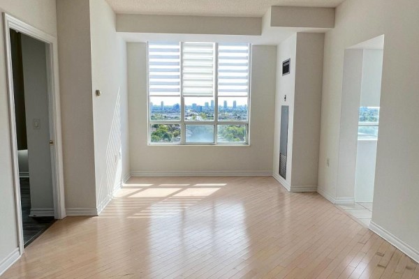 Living room with large windows, city view, and wood flooring. - Lph17 - 2627 Mccowan Road, Toronto