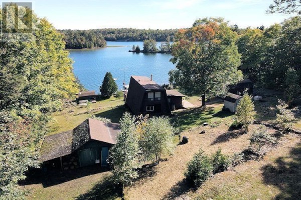 Aerial view of the property and surrounding forested area with Lake Lauzon in the distance. - Lt 10 Pl M90 Long Twp, Sugar Island, Lake Lauzon, Algoma Mills