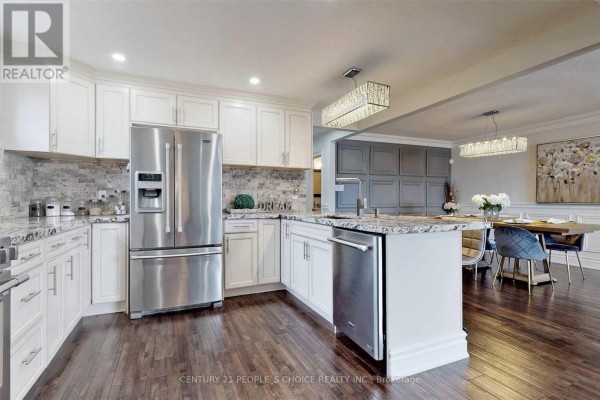 Kitchen with white cabinetry, stainless steel appliances, and granite countertops. - Main - 107 Spenvalley Drive, Toronto