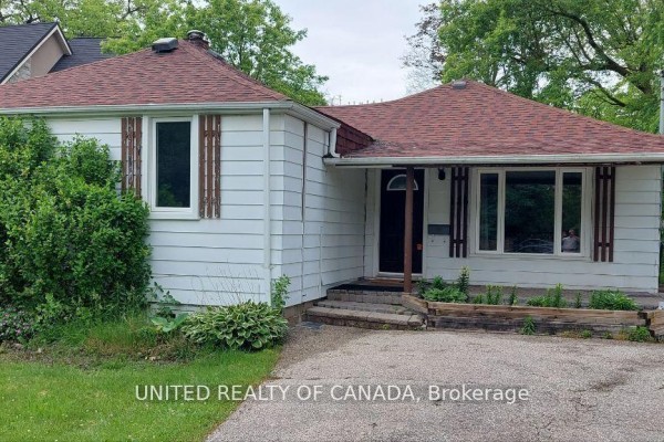 Close-up of the front porch with a dark door, large windows, and stone paving. - Main - 126 Weldrick Road W, Richmond Hill