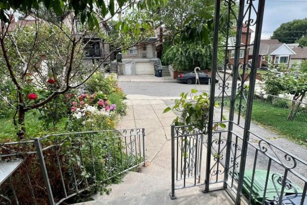 View from the porch looking down the driveway and towards the street. - Main - 354 Kane Avenue, Toronto