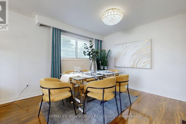 Dining room with glass table, yellow chairs, and abstract gold wall art, featuring a crystal chandelier. - Main Floor - 93 Clark Avenue, Markham