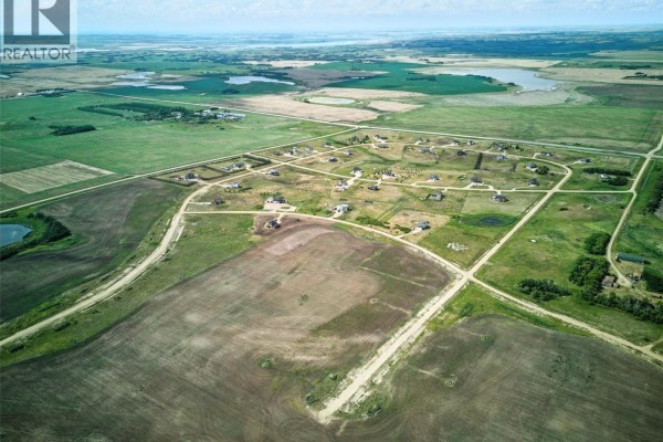 Aerial panorama of Meadowlark Estates development with surrounding agricultural fields and blue sky. - Meadowlark Development Package, Blucher Rm No  343