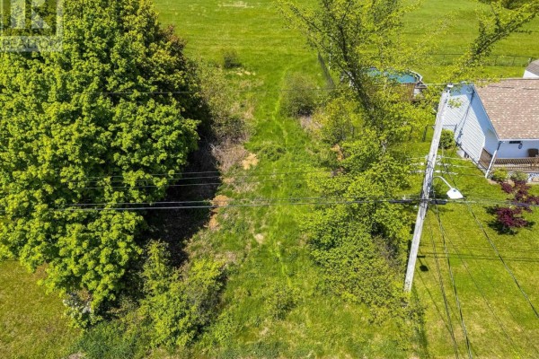 Aerial view showcasing a mix of residential areas and dense forest in Kentville. - Mill Run Extension Extension, Kentville