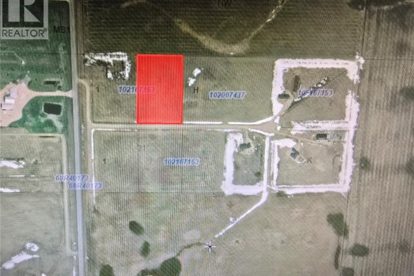 Aerial view of land parcels, one highlighted in red, with roads and buildings. - Minard South Lot 2, Weyburn Rm No  67