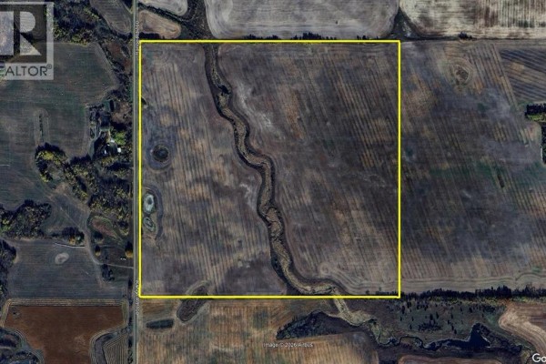 Overhead view of a square 160-acre property outlined in yellow, showing fields and a winding creek. - Mundare 160 Acres, Rural Minburn No  27, County Of