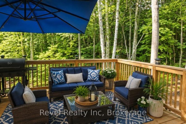 Outdoor furniture and grill on wooden deck with trees - N/a - 157 Desroches Trail Tiny