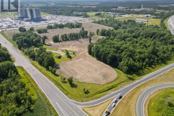 Aerial view with red outline on cleared fields and treed areas, bordered by roads. - N/a Lyons Creek Road, Niagara Falls