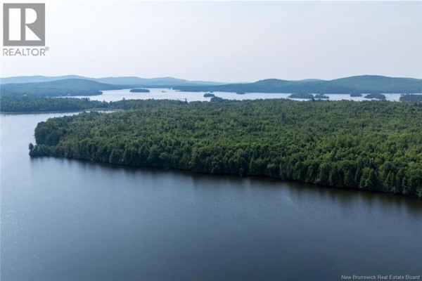 Aerial view of islands covered in trees on a wide lake with rolling hills in the distance. - N/a Mud Lake Road, Upper Skiff Lake