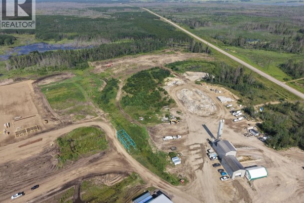 Aerial view of industrial buildings, construction materials, and heavy machinery at Northgate Industrial Lot 1. - Northgate Industrial Lot 1, Buckland Rm No  491
