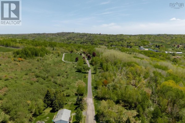 Expansive aerial view of residential lots surrounded by dense green foliage. - Oak Street, Trenton, Trenton