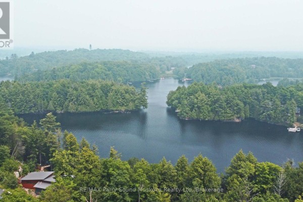 Aerial view of a wooded area with a lake and residential properties nearby. - Part 1 - 0 Lyndsey Lane, Mckellar