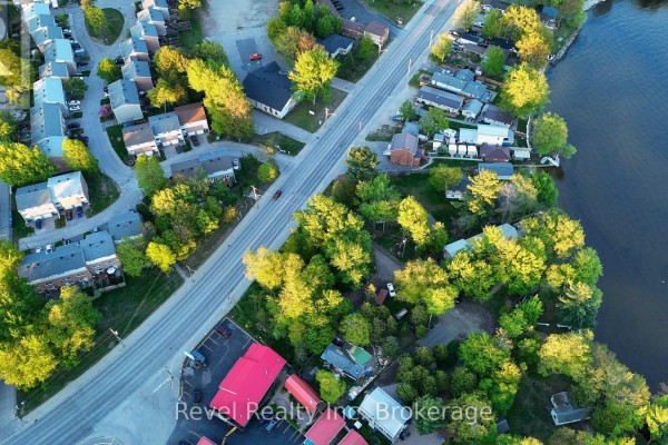 Panoramic aerial view of Lakeshore Drive, showcasing waterfront properties, residential streets, and dense green foliage. - Part Lot 99 Lakeshore Drive, North Bay