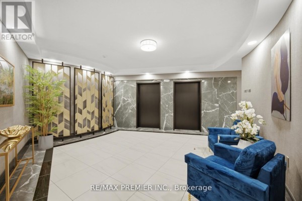Elevator lobby with grey marble walls, tiled floor, and blue velvet chairs. - Ph 21 - 8201 Islington Avenue, Vaughan