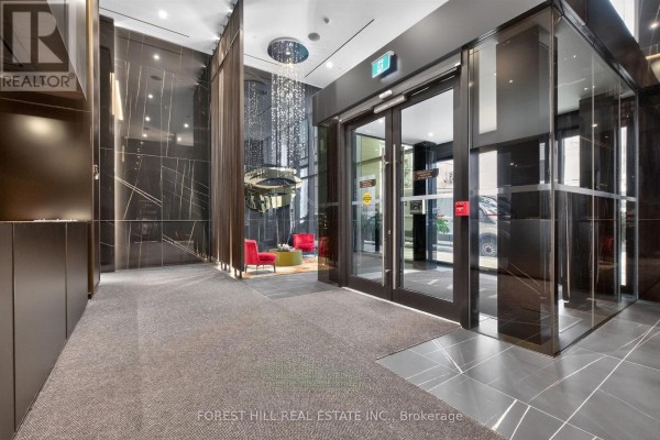 Living room with a sectional sofa, TV, dining table, and panoramic city views through large windows. - Ph02 - 11 Yorkville Avenue, Toronto