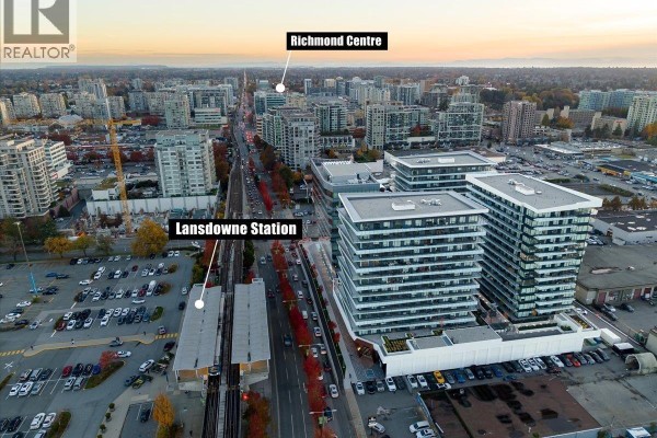 Aerial view of a modern apartment building complex with surrounding urban landscape. - Ph1506 7977 Lansdowne Road, Richmond