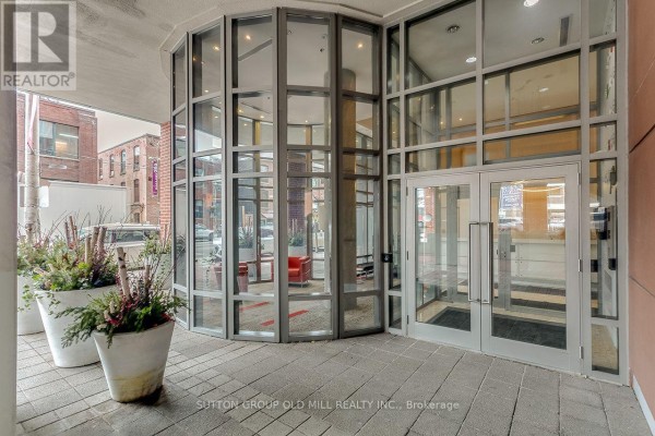 Reception area with white desk, wooden accents, and elevator access - Ph2 - 255 Richmond Street E, Toronto