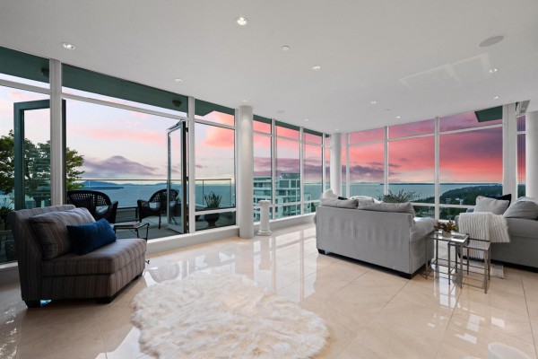 Bright living room with modern furniture and expansive ocean view. - Ph2 1473 Johnston Road, White Rock