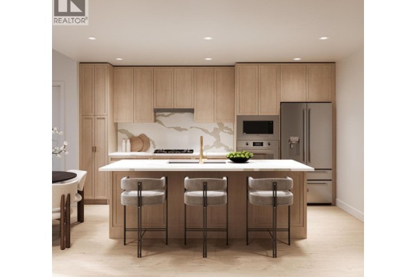 Kitchen with island, bar stools, stainless steel appliances, light wood cabinets, and marble backsplash. - Ph2 4451 Hastings Street, Burnaby